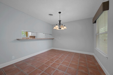 Unfurnished dining area with a textured ceiling, 