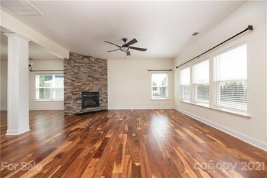 Cozy up to this custom Fireplace or cool off under the Ceiling fan