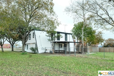 Back of Main Building showing exterior covered dec