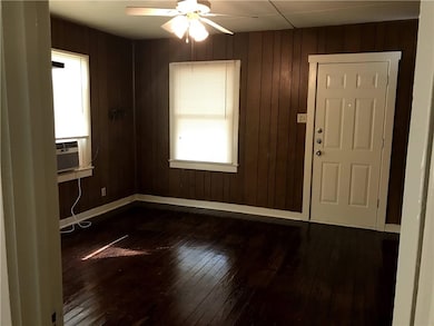 Foyer entrance featuring dark wood-style flooring,