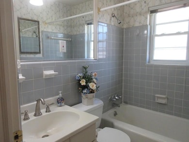 Full bathroom featuring a sink, shower / bathing t