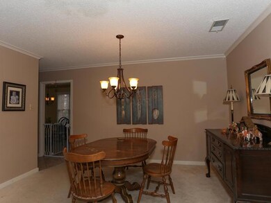 Cozy dining room has rom for big buffet.