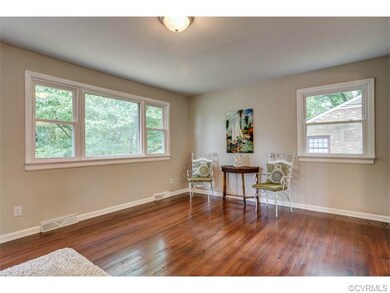 Family room with refinished hardwood floors, fresh