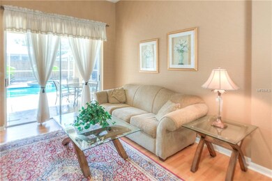 Living room has views to the pool & lanai.