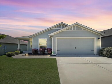Ranch-style house featuring concrete driveway, a 