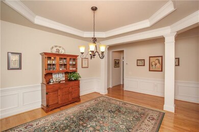The dining room, with its trey ceiling, is located