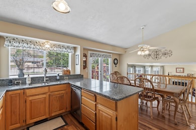 Kitchen with vaulted ceiling and a large peninsula