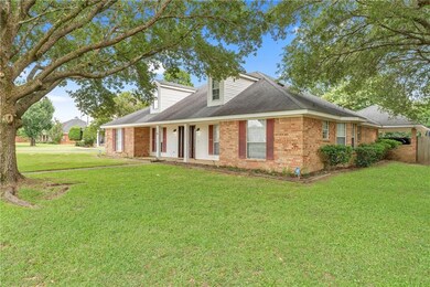 Cape cod-style house featuring brick siding and roof with shingles