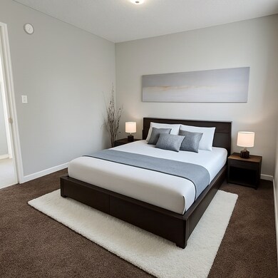Spacious bedroom with natural light, cozy carpet,