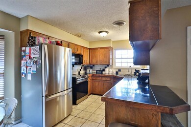 Kitchen featuring stainless steel appliances, sink