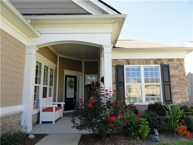 Attractive shaded front porch.