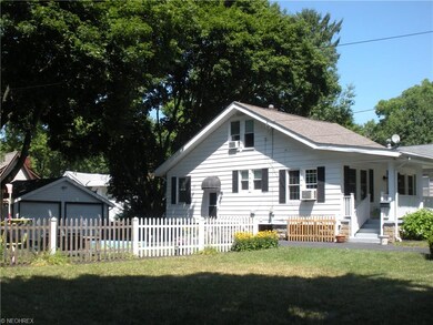 Looking Northwest; two car garage and additional p