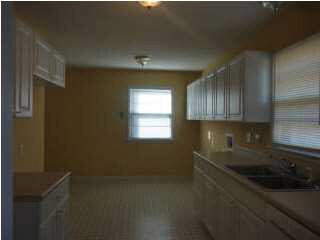 View of the kitchen from dining area. Cabinets go 