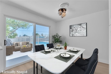 Dining area with light wood finished floors