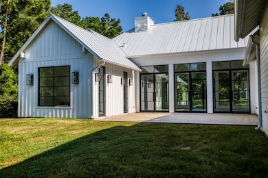 The back of this home has a huge courtyard patio a