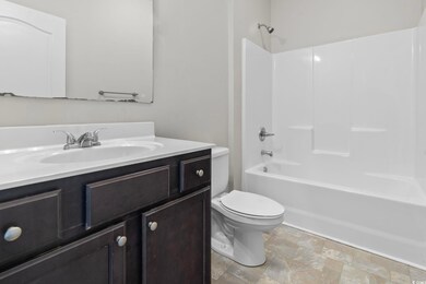 Full bathroom with vanity, toilet, and shower / ba