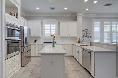 The home’s updated island kitchen now boasts upgra