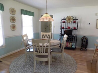 Spacious breakfast room, chair rail molding