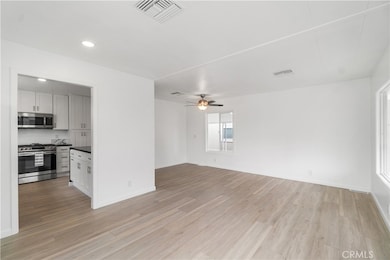 View from front door entry.  Living room, dining room, kithchen