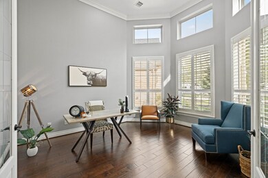 Grand study with high ceilings