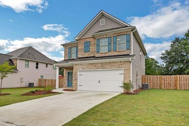 Craftsman-style home with central AC, a front lawn