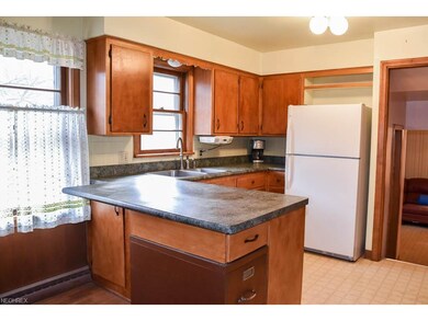 Kitchen has newer countertops and a breakfast bar.