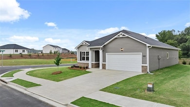 View of front of home featuring a garage and a fro