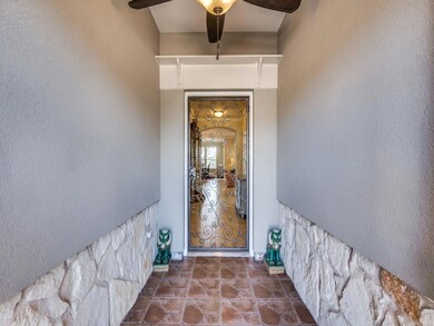 Enclosed Foyer with Decorative Iron Door