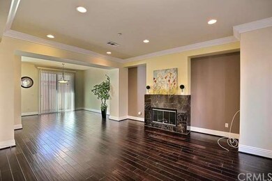 Spacious living room with fireplace and laminated 