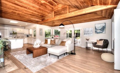 FAMILY ROOM HAS WOOD BEAMED CEILING