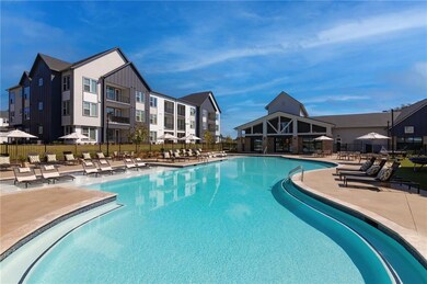 Community pool with a patio