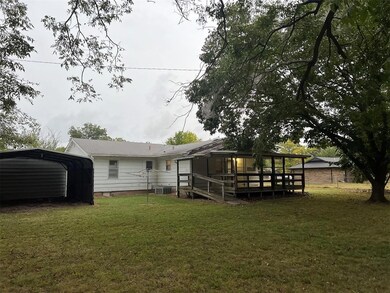 Rear view of property featuring central air condit