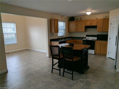 View of sunroom that is off the kitchen with a sli