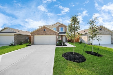 This photo showcases a modern two-story brick home