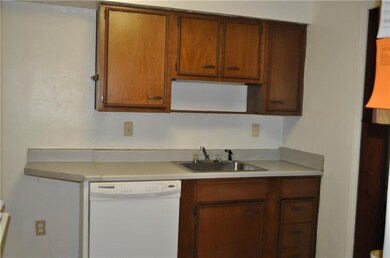 Warm wood cabinets and space for dishwasher!