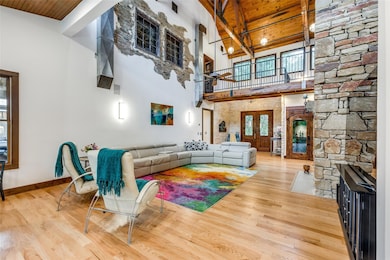Living room with a wood ceiling with exposed beam