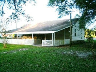 Rear view of Covered patio/car-cover