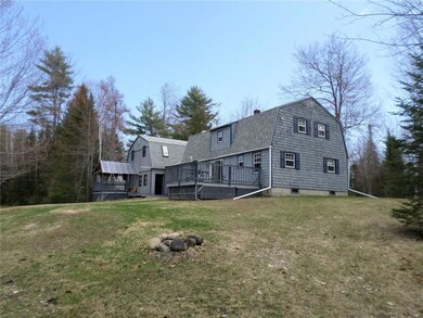 Back of home showing rear deck and...
