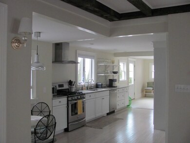 Dining room looking into kitchen.