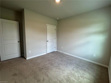 Unfurnished bedroom with carpet