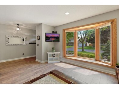 Entry and living room with bowed window