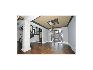 Dining Rm w/ hardwood floors & detailed ceiling