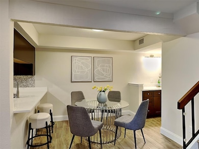 Dining room featuring baseboards, light wood-style