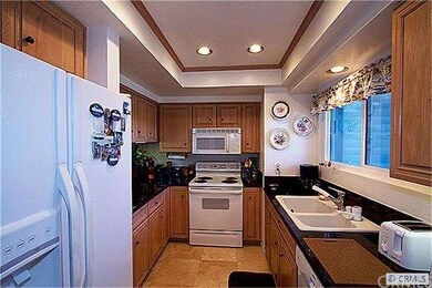 granite countertops, recessed lighting, marble flo