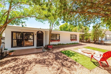 Back of property featuring stucco siding