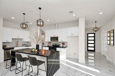 Marble flooring and upgraded light fixtures. The h