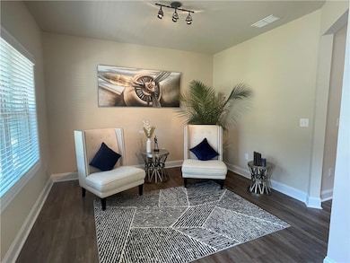 Living area featuring plenty of natural light, dar