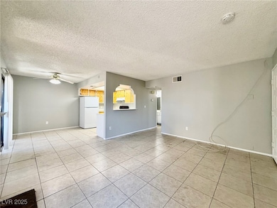 Unfurnished living room with light tile patterned