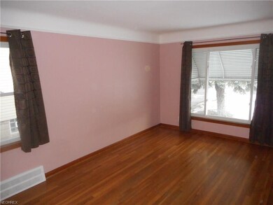 The east and south walls of the living room.