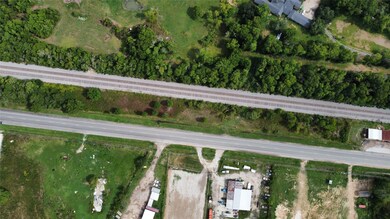 Notice the metal building on adjacent property to